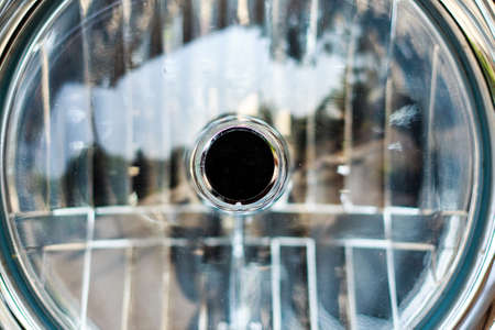 Detail on the headlight of a classic motorcycle の写真素材