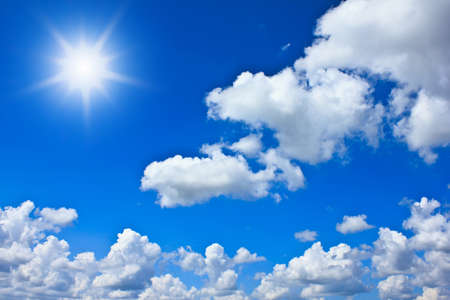 Beautiful blue sky background with white cloudsの写真素材