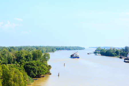 A container ship departure from port on a very calm day.のeditorial素材