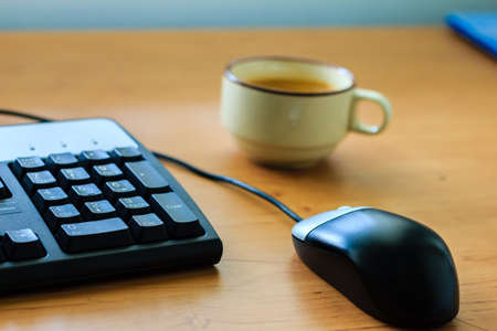cup with black coffee at business workplace