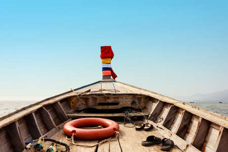 Boat floats near the shore. Adventure Lifestyle 