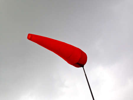 fire-red airsock on Gray steelの写真素材