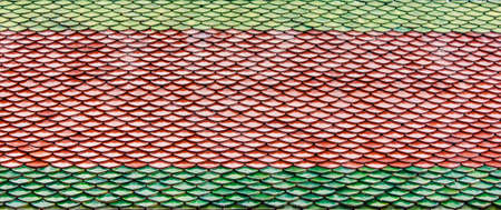 Traditional tiles roof thai style of ancient temple の写真素材