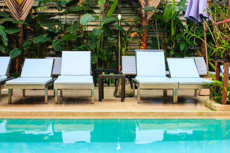 The beautiful Lounge sunbed in swimming pool のeditorial素材