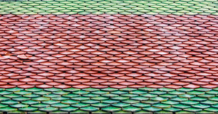 Traditional tiles roof thai style of ancient temple の写真素材