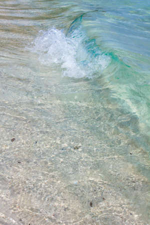Wave of the sea on the sand beach の写真素材
