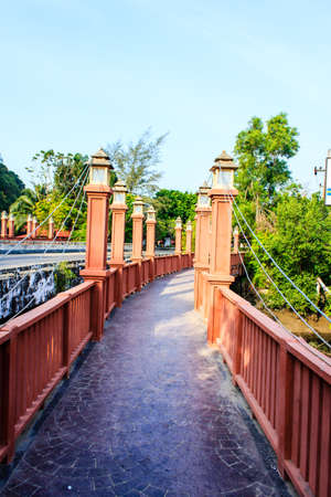 Bridge over the brook into the wild の写真素材