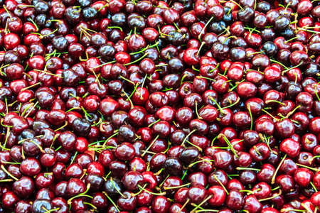 Background of ripe cherries in the farmer marketの写真素材