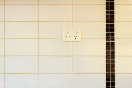 Tiles white - grey  and electrical plug