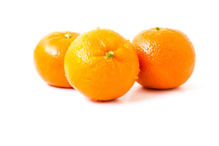 Fresh orange fruit on the white backgroundの写真素材