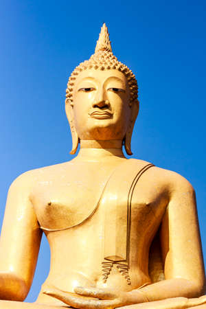 Big golden buddha white blue sky backgroundの写真素材