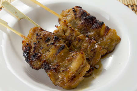 Sticky Pork bbq traditional thai food on white dishの写真素材