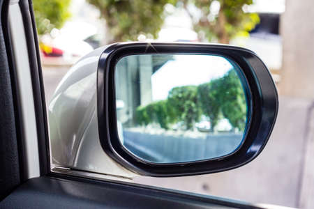 The mirror of the car with the roadの写真素材