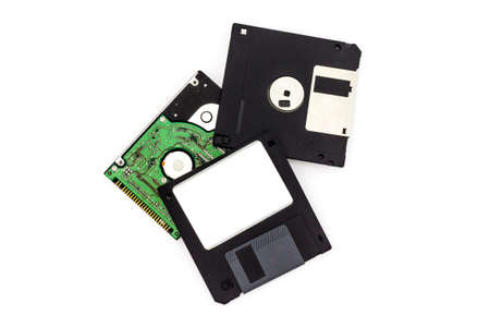 Floppy disk and hard disk on white backgroundの写真素材