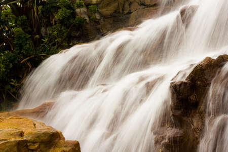 photography of beautiful waterfall on the rocksの写真素材