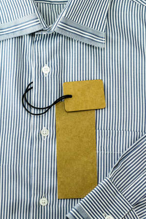 Brown tag label on white & blue shirtの写真素材