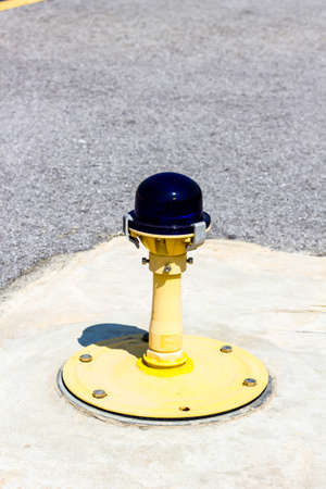 Ground side lamp taxiway at the airportの写真素材