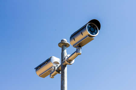 The Security camera on blue sky backgroundの写真素材