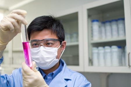 An Analyst is observing a chemical tubeの写真素材