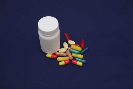 colorful capsules and pills with packaging on pure backroundの写真素材