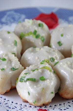 Chinese characteristic fried bun on a porcelain plateの写真素材
