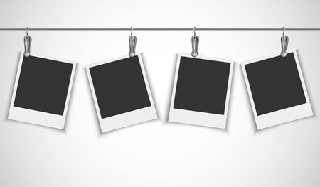 Blank photo frame hanging on a wire rope with metallic clipのイラスト素材