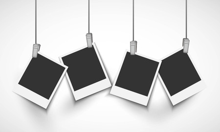 Blank photo frame hanging on a line with metallic clipのイラスト素材