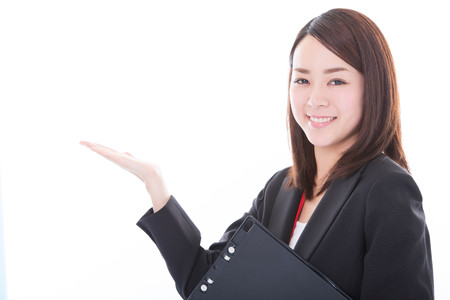 Smiling business woman showing on copy spaceの写真素材
