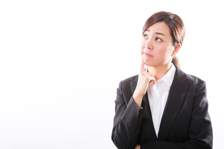 Portrait of a business young woman thinkingの写真素材