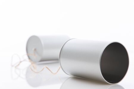 Tin cans telephone on white backgroundの写真素材