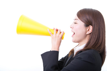 Young business woman with megaphoneの写真素材