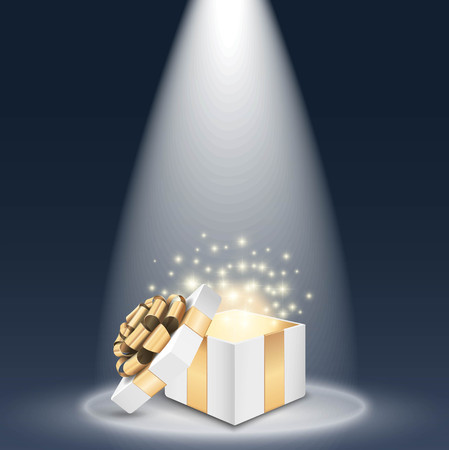 Opened gift box with shining light in the spotlightのイラスト素材