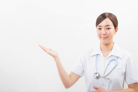 Portrait of a smiling young nurseの写真素材