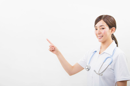 Portrait of a smiling young nurseの写真素材