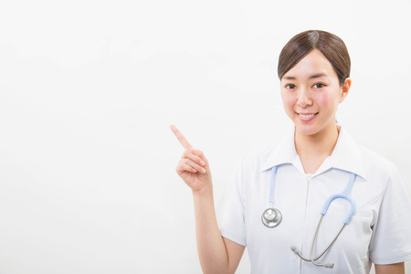 Portrait of a smiling young nurseの写真素材