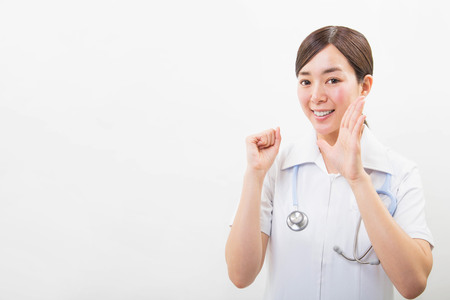 Portrait of a smiling young nurseの写真素材