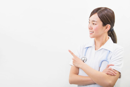 Portrait of a smiling young nurseの写真素材