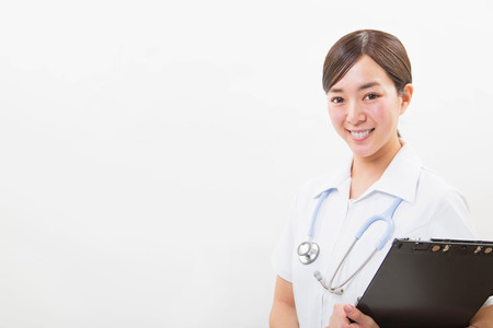 Portrait of a smiling young nurseの写真素材