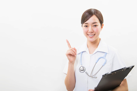 Portrait of a smiling young nurseの写真素材