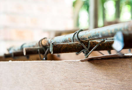A bar of Steel is tied with a smaller wireの写真素材