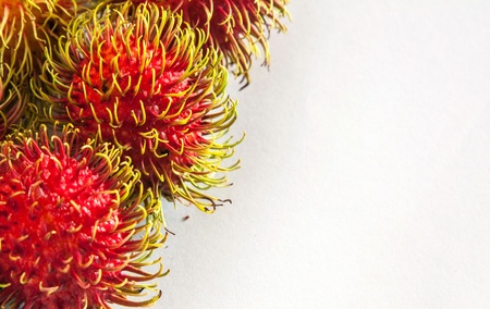 The ripe rambutans on white backgroundの写真素材