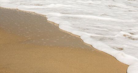 Sand ,beach  and foam as backgroundの写真素材
