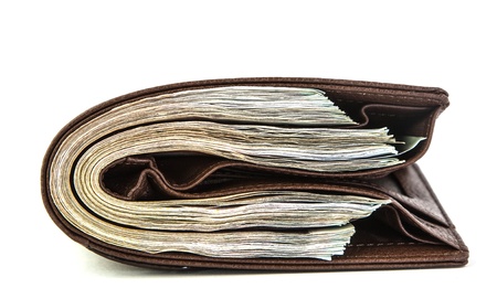 Many money in pocket on white backgroundの写真素材