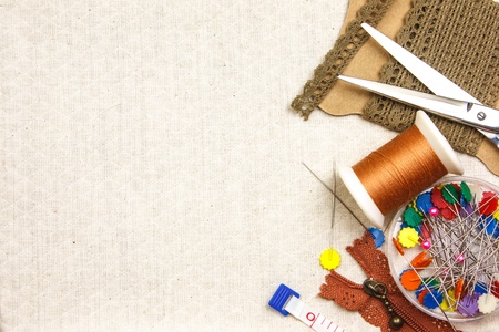 Embroidery tool on cloth as background