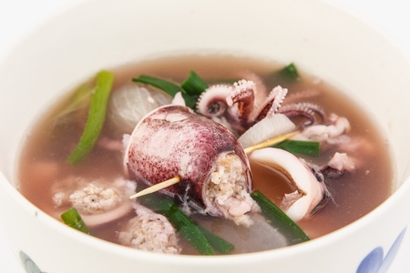 Tasty stuffed squid soup in bowlの写真素材