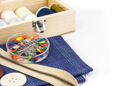 Embroidery tool  on left against white background