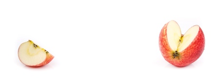 slice of red apple in opposite side on white backgroundの写真素材