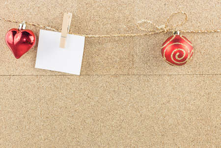 Christmas background with decoration object hanging against brown wood