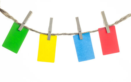 Colorful paper hang with rope isolated on whiteの写真素材