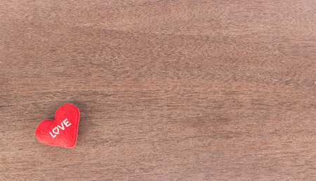 valentines day background - top view of red heart  on wooden  backgroundの写真素材